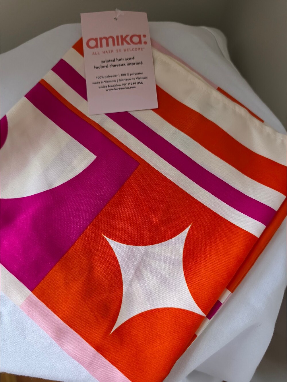 amika geometric silk-look scarf in orange, fuchsia & white